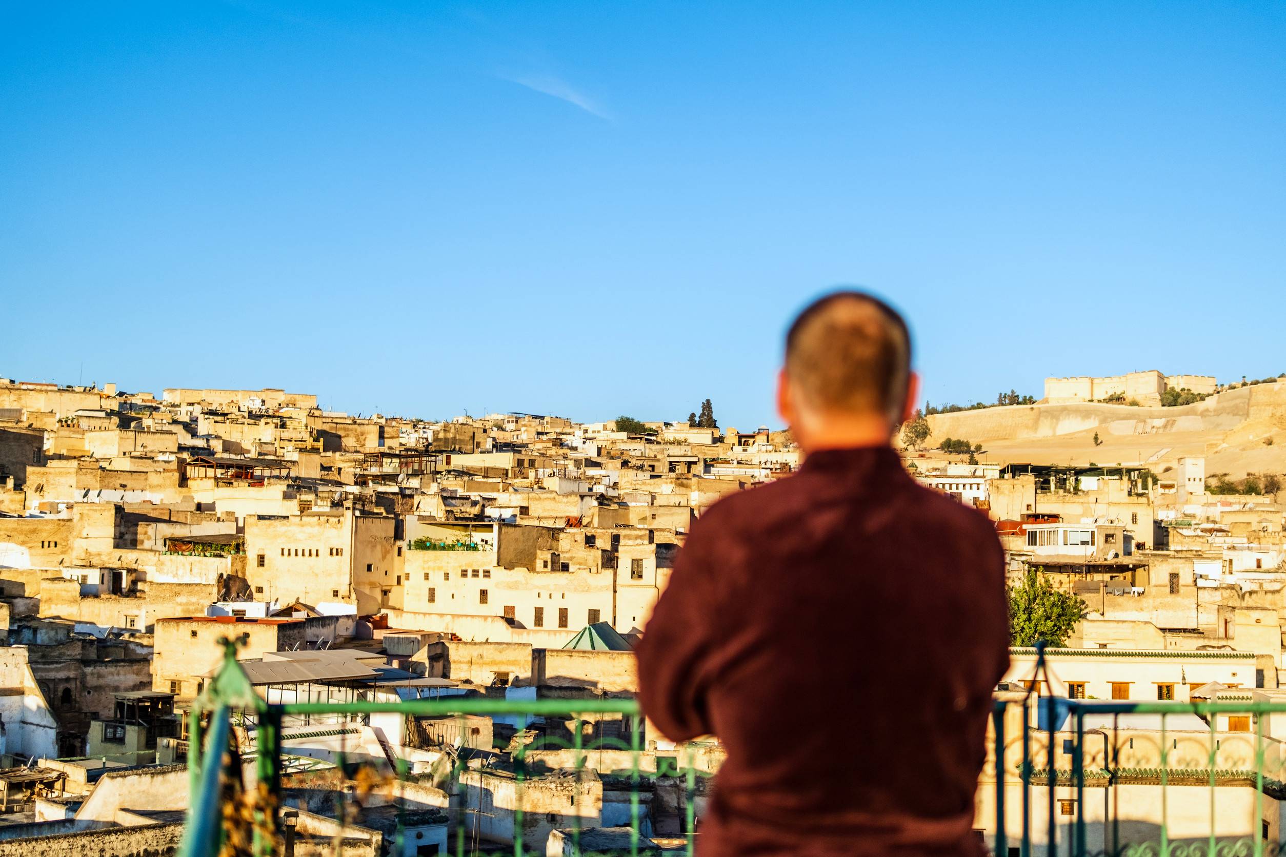 Male rooftop viewer of Fez Morocco North Africa Male rooftop viewer of Fez Morocco North Africa