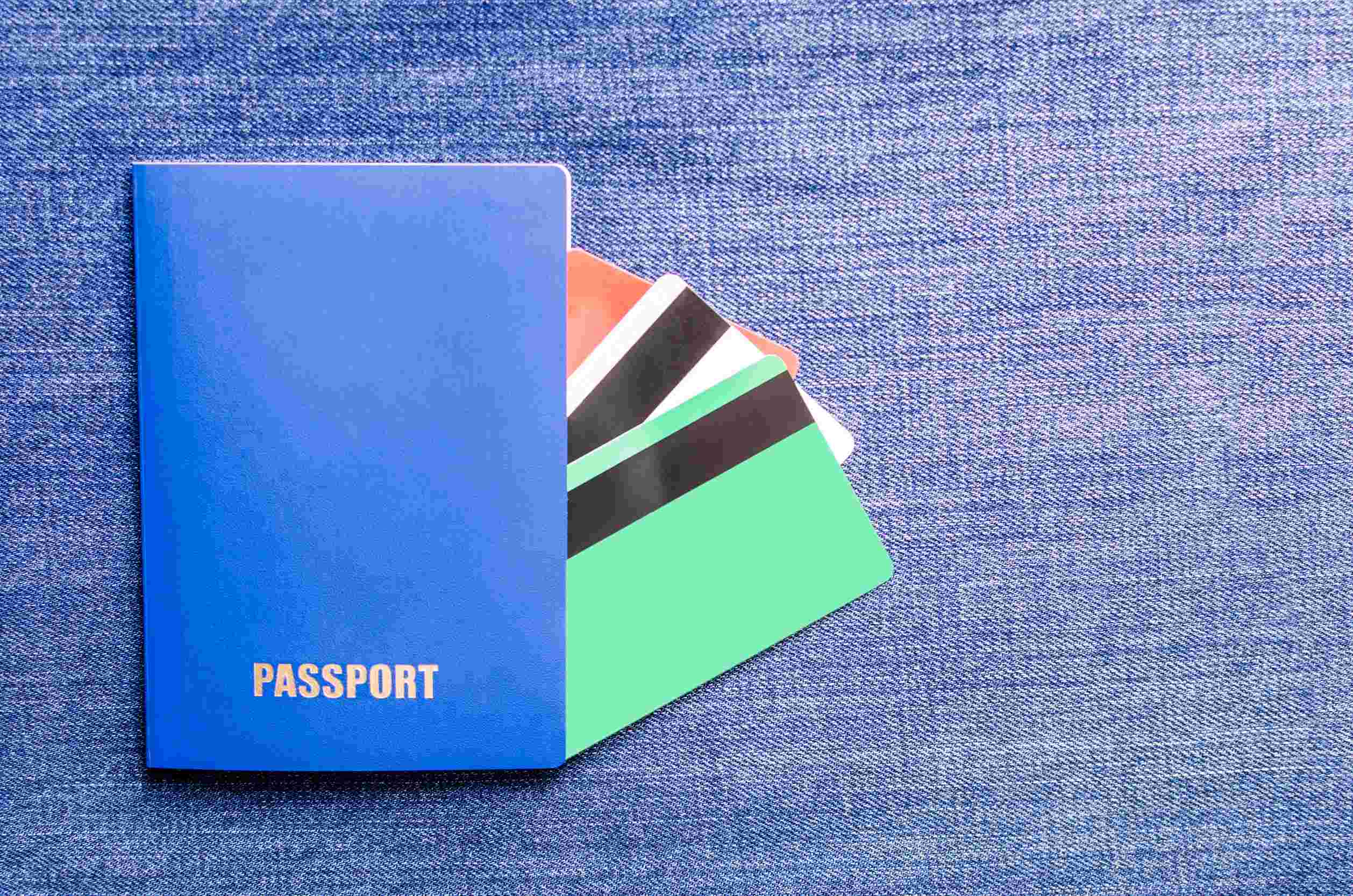 Passport With Credit Cards On Denim Passport With Credit Cards On Denim